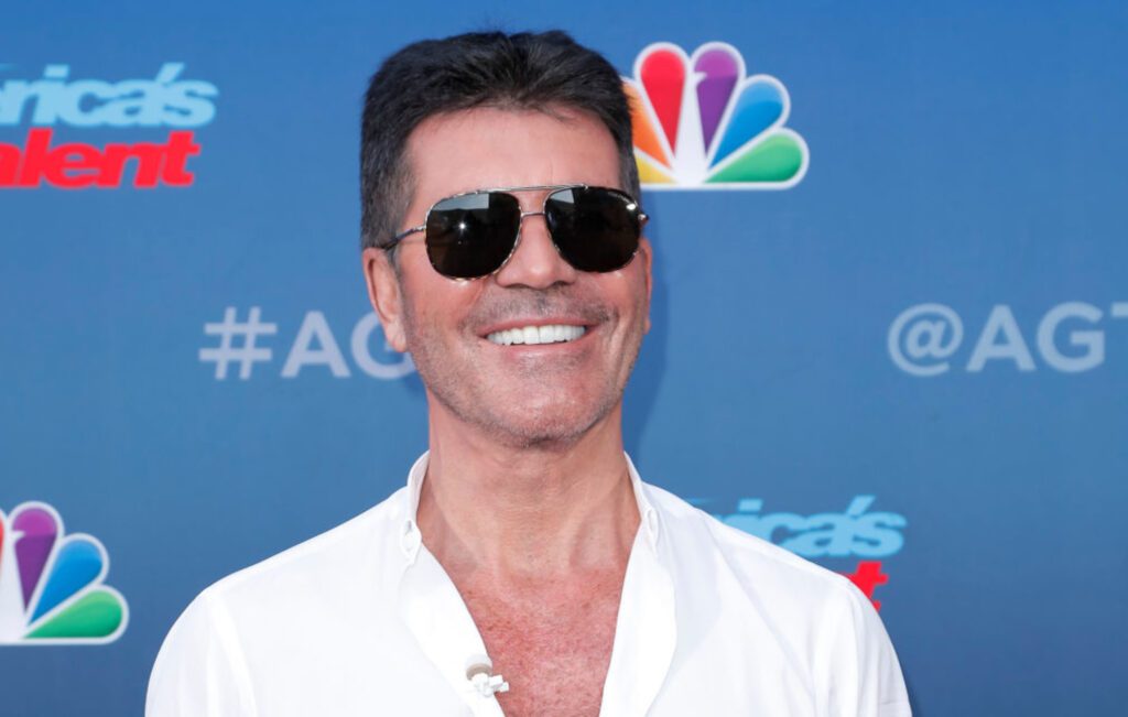 Simon Cowell hospitalised after breaking his back falling off bike