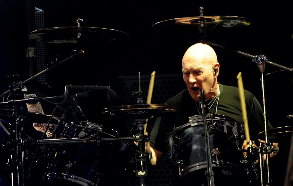 Chris Slade says he still believes that he is AC/DC's drummer