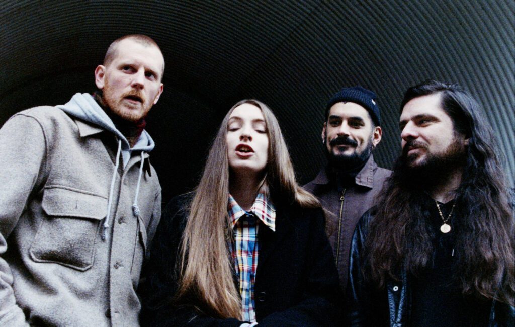 Dry Cleaning perform in a carpet shop in new 'Unsmart Lady' music video | NME