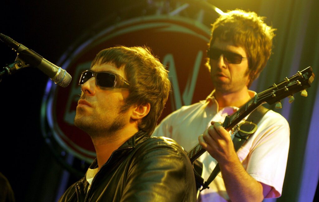 Oasis' “battered” tambourine and bespoke football shirts to be auctioned off