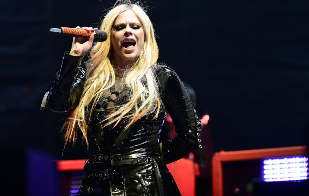 Avril Lavigne performing live on-stage in 2022