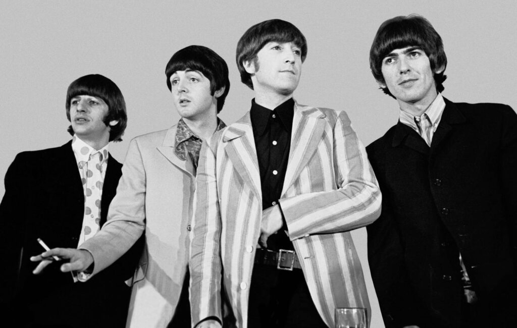 a black and white photograph of The Beatles in New York in 1966
