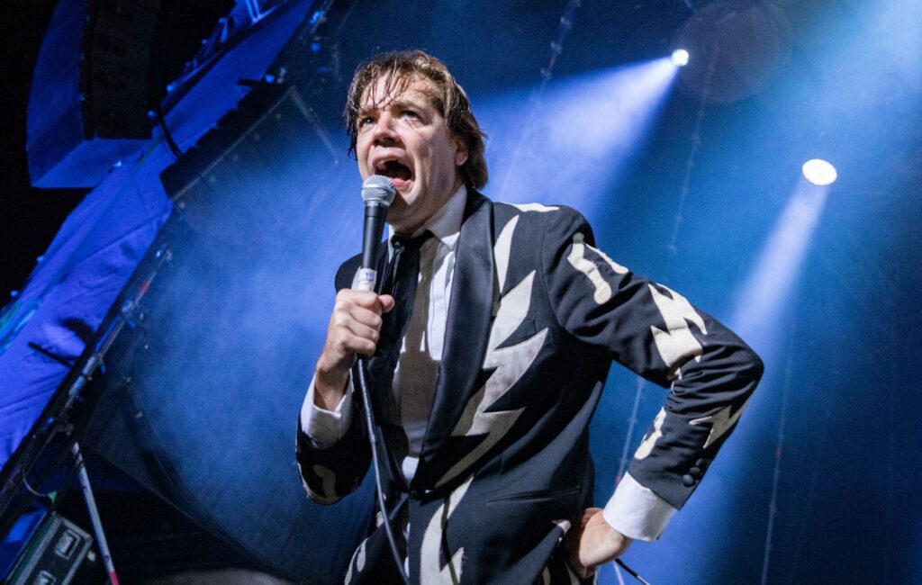 The Hives’ Pelle Almqvist cuts head while swinging microphone but finishes gig