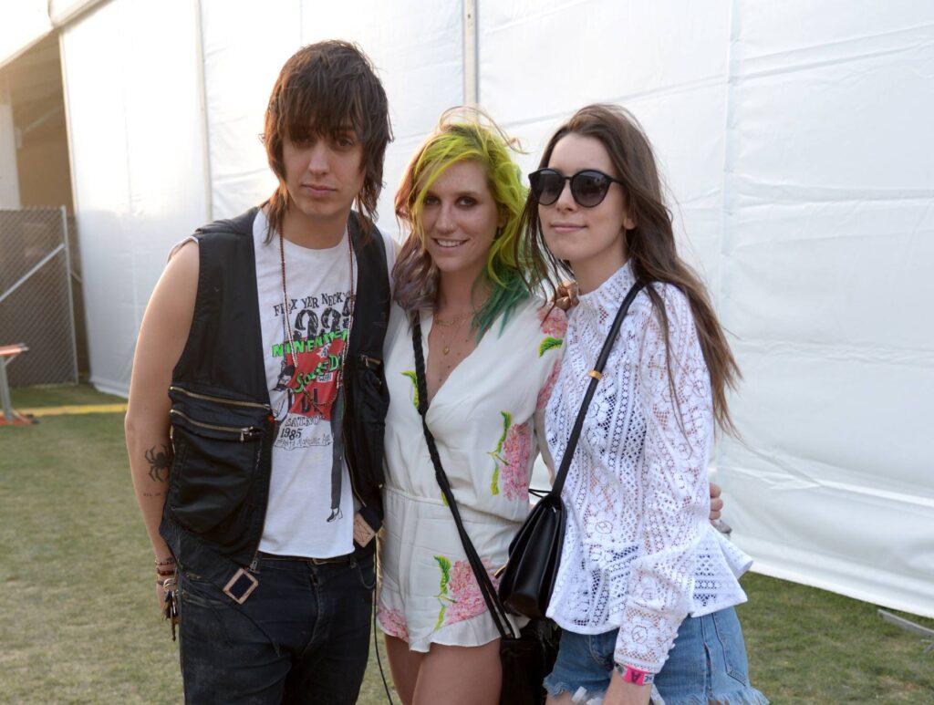 Julian Casablancas, Kesha and Danielle Haim pose backstage during day 2 of the 2014 Coachella Valley Music & Arts Festival. Credit: Jason Kempin/Getty