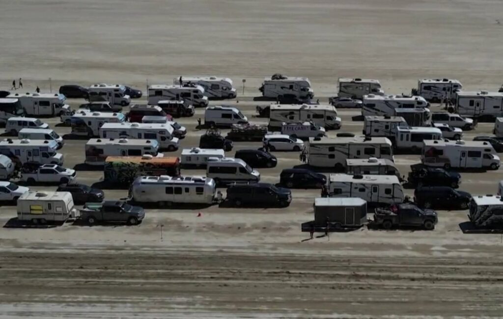 Burning Man revellers make mass exodus as police name dead festival goer