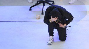 US rapper Eminem kneels on stage during the halftime show of Super Bowl LVI between the Los Angeles Rams and the Cincinnati Bengals at SoFi Stadium in Inglewood, California, on February 13, 2022. (Photo by VALERIE MACON / AFP) (Photo by VALERIE MACON/AFP via Getty Images)