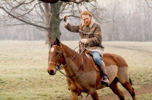 Ginger Baker poses for a photo on his horse circa 1975.