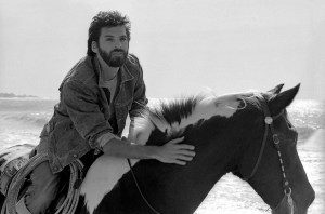 Kenny Loggins rides his horse at the beach circa 1985 in Los Angeles, CA.