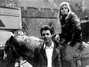 Paul McCartney and Linda McCartney, atop her appoloosa horse, pose in front of a castle near Dover in 1979.