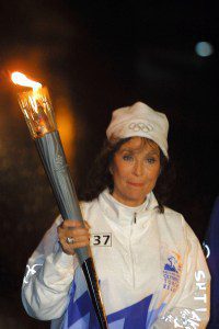 Loretta Lynn carries the Olympic Flame during the 2002 Salt Lake Olympic Torch Relay Dec. 16, 2001 in Louisville, KY.