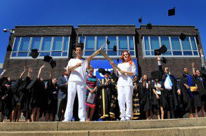 Kathleen Brien aka Katy B passes the Olympic Flame to Torchbearer 096 Mark Ronson at Brunel University during day 67 of the Olympic Torch Relay on July 24, 2012 in London, England.