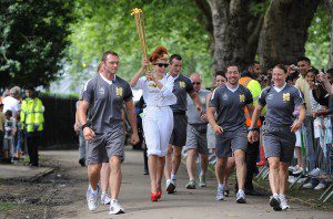 Paloma Faith carries the Olympic Flame on the Torch Relay leg through the borough of Newham during Day 64 of the London 2012 Olympic Torch Relay on July 21, 2012 in London, England.