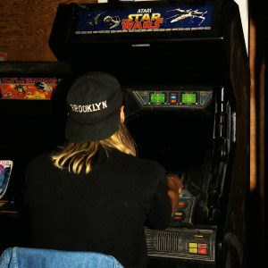 LOS ANGELES- NOVEMBER 24: Paul D'Amour, bassist in Tool, viewed from behind as he plays Atari Star Wars video game at the Jello Loft in Hollywood on November 24, 1991 in Los Angeles. (Photo: Lindsay Brice/Getty Images)