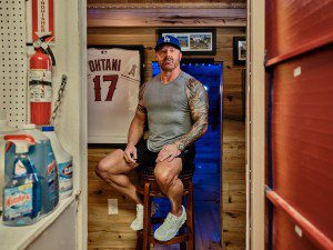 SAN JUAN CAPISTRANO, CALIFORNIA - October 25, 2024: Mathew Bowyer, 49, book maker, poses for a portrait at his home. CREDIT: Philip Cheung for Rolling Stone