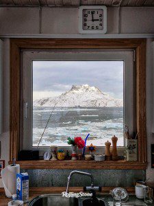 A view of Sermitsiaq mountain from the kitchen window of Aqqaluk Lynge, former Chair of the Inuit Circumpolar Council (ICC) and current president of ICC Greenland. A lifelong advocate for Greenland’s autonomy and Inuit unity across the Arctic, Lynge served in Greenland’s Parliament for 16 years and was Vice Chair of the UN Permanent Forum on Indigenous Issues in 2007. A poet and writer, he has published a dozen books. Sermitsiaq Mountain, Nuuk’s most prominent landmark, is featured on the city’s flag and coat of arms. Its distinctive saddle-shaped summit ridge has three peaks, with steep rock formations on the south and glaciers on the north. The mountain also hosts a popular waterfall, attracting tourists.